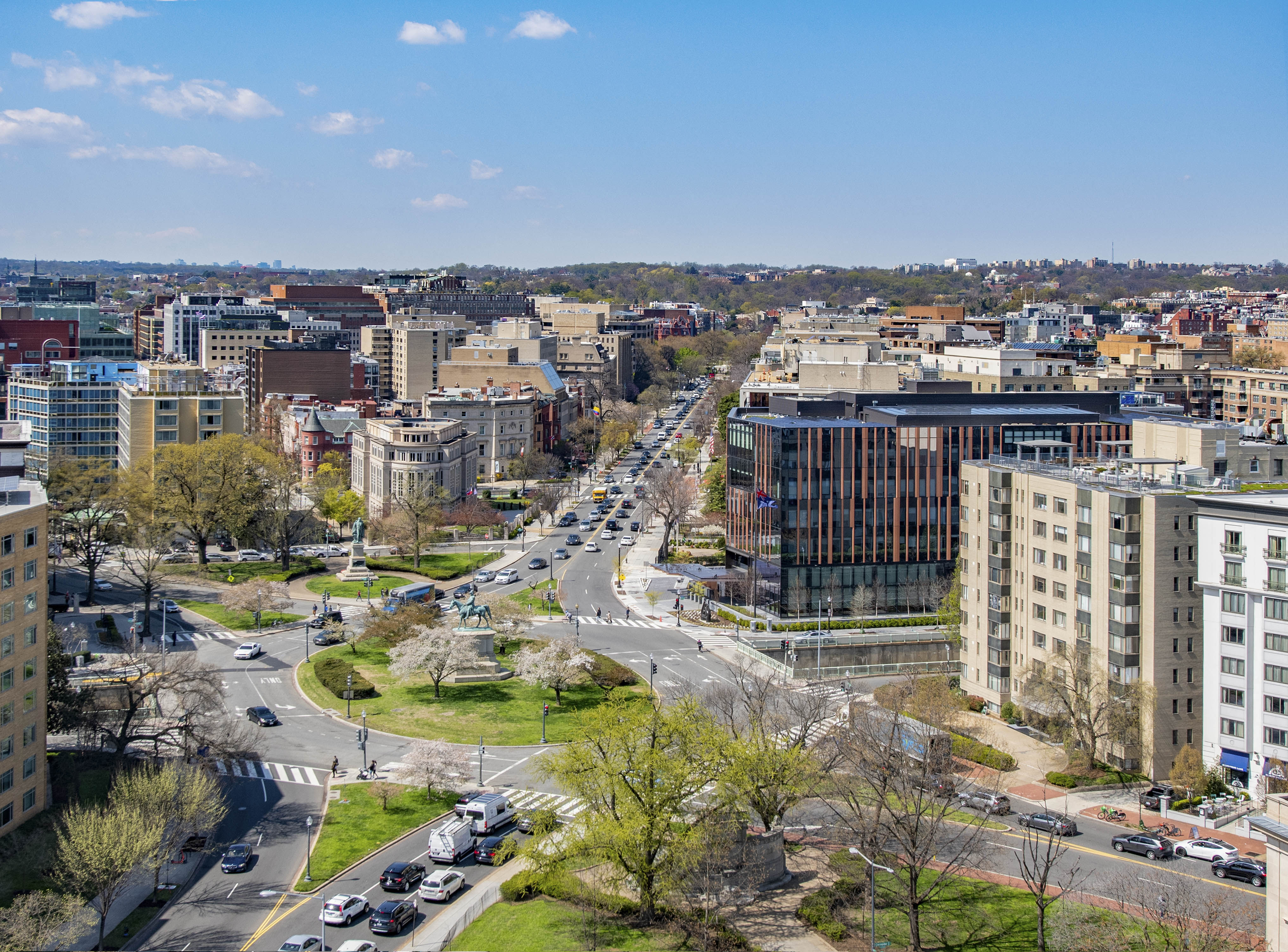 an aerial view of a busy city street with cars and buildings