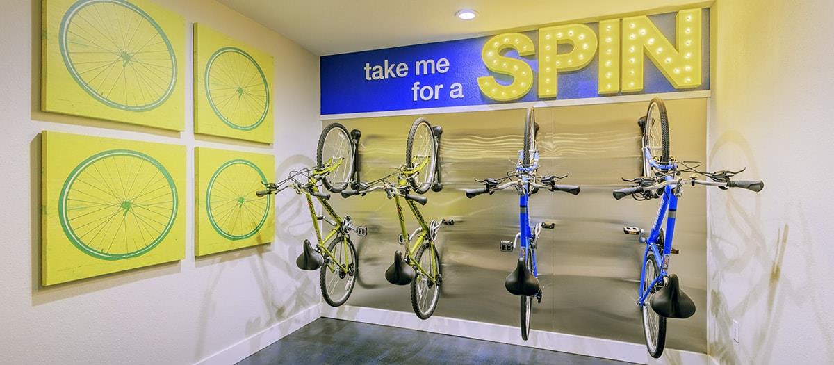 a store with several bikes hanging on the wall