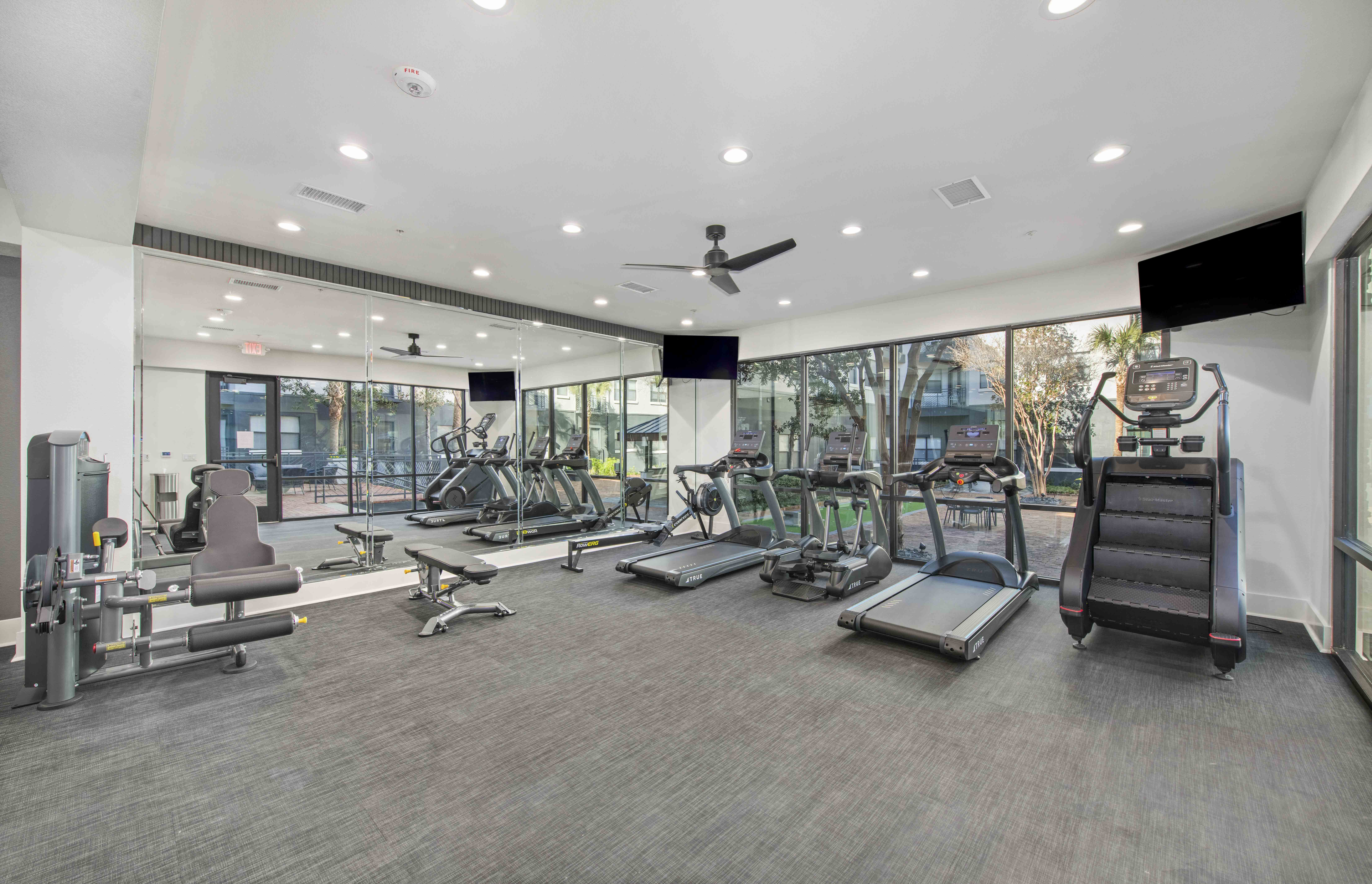 the gym is equipped with state of the art equipment including cardio machines and weights
