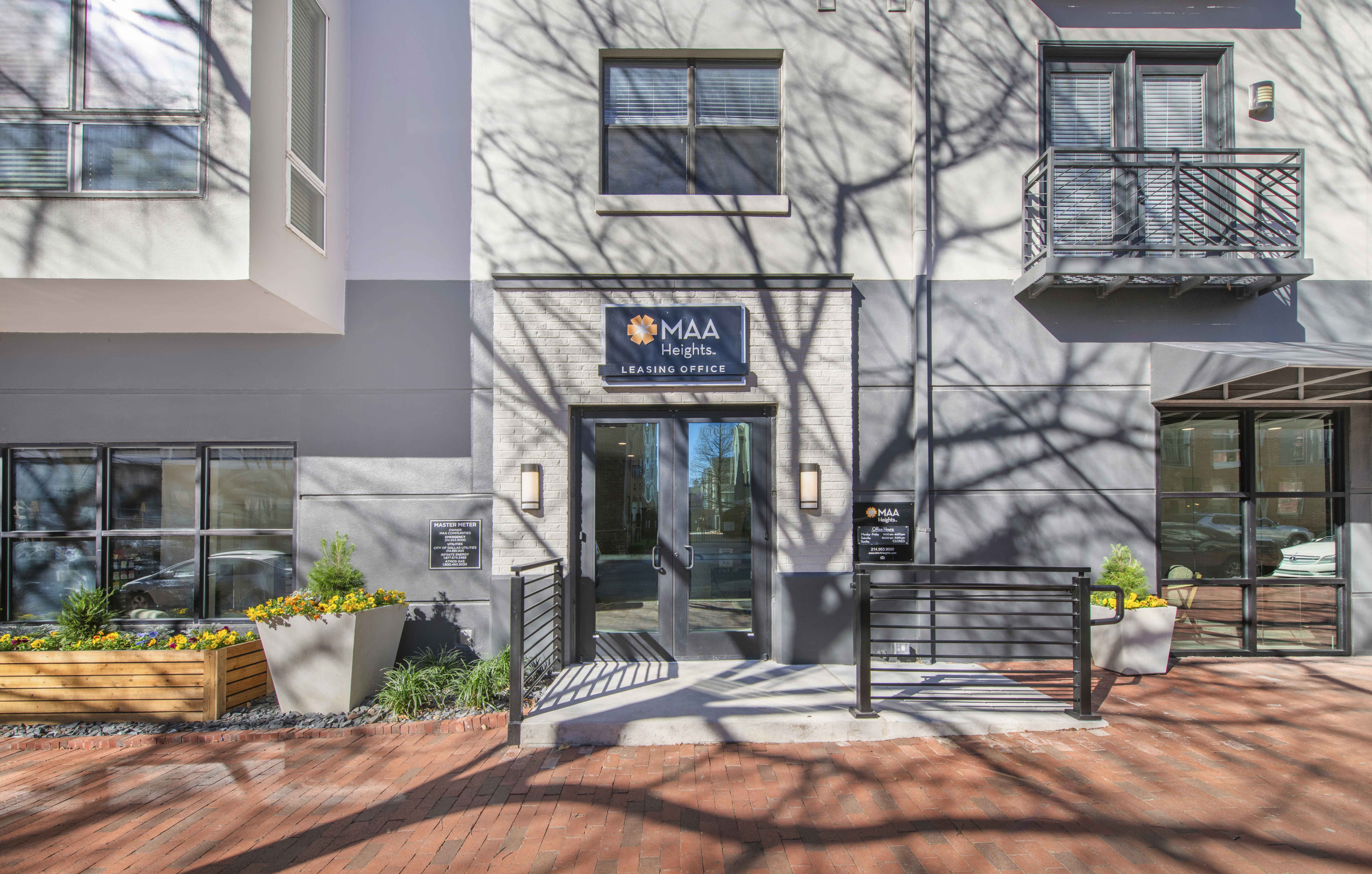 front entrance of a building with a bench in front of the door