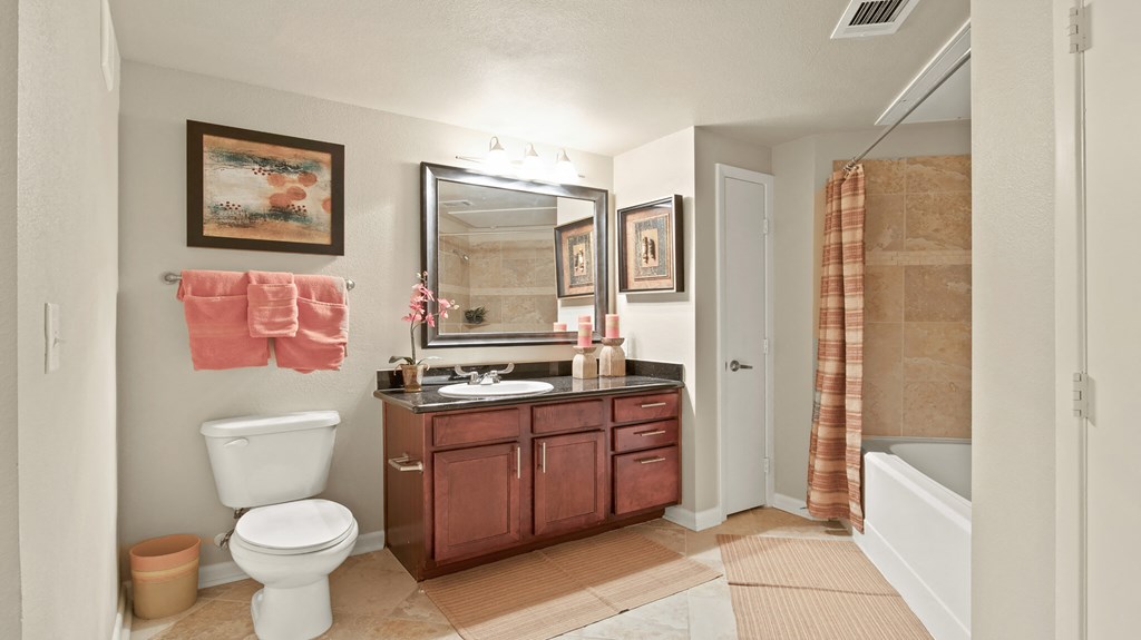 a bathroom with a toilet sink and a shower