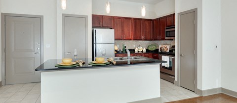 a kitchen with a counter top and a refrigerator