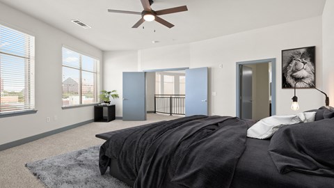 a bedroom with a bed and a ceiling fan