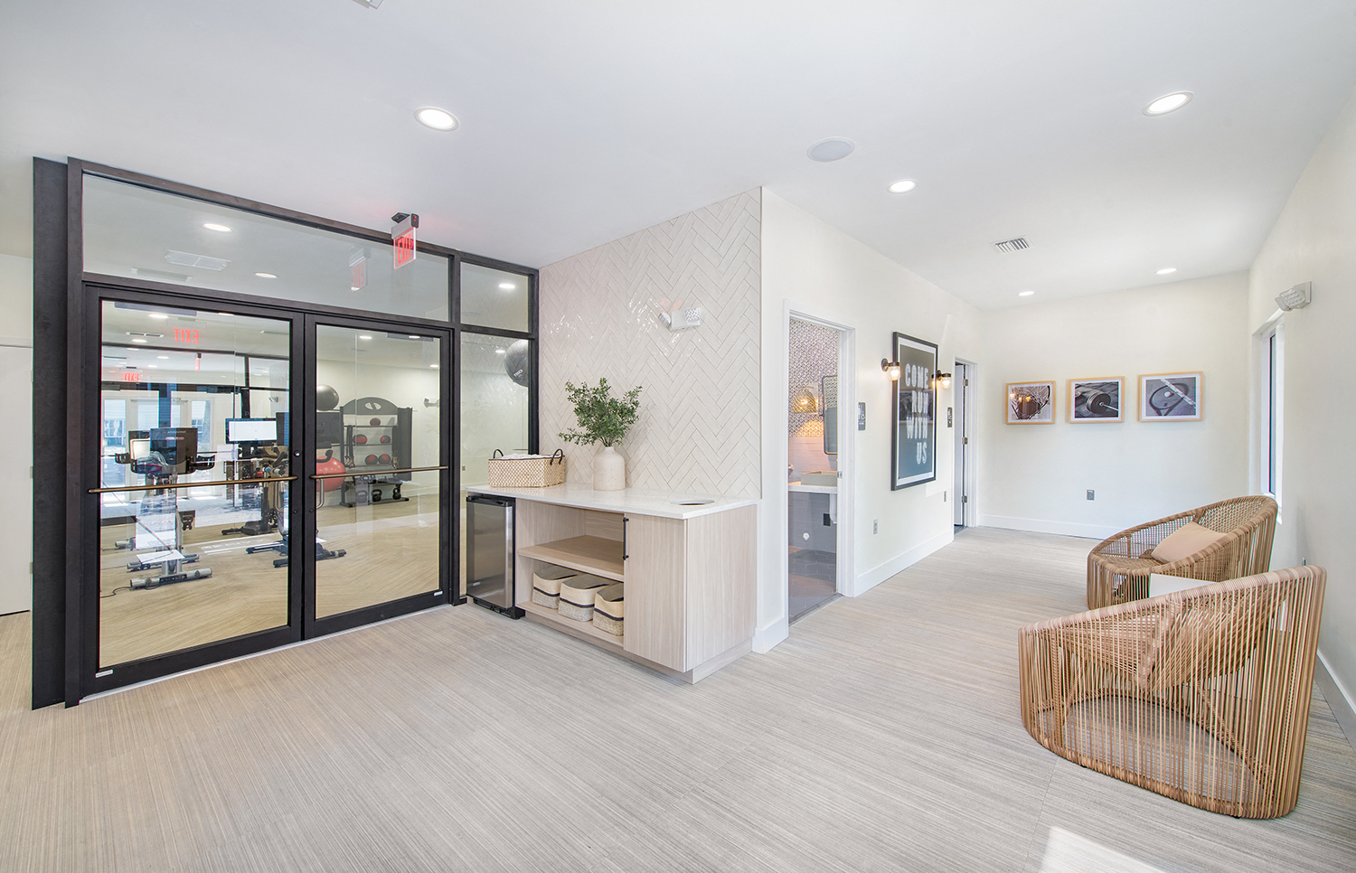 a conference room with glass sliding doors and a table with chairs