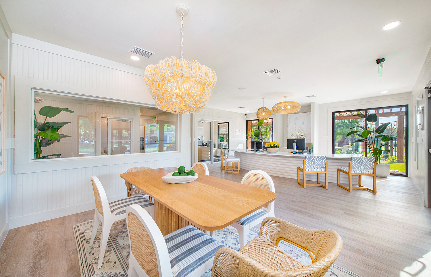 a dining room with a wooden table and chairs