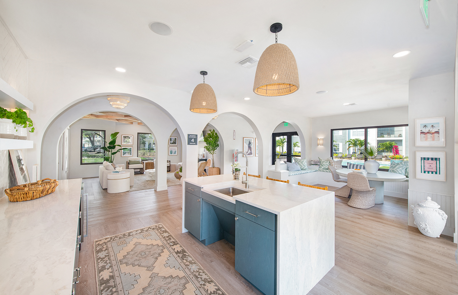 a kitchen with a blue island in the middle of a living room