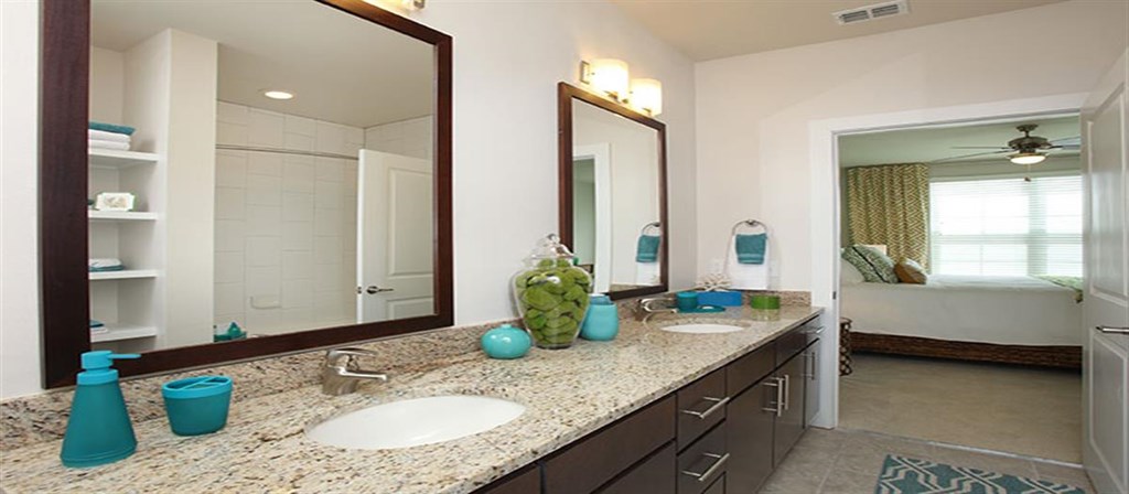 a bathroom with two sinks and a large mirror