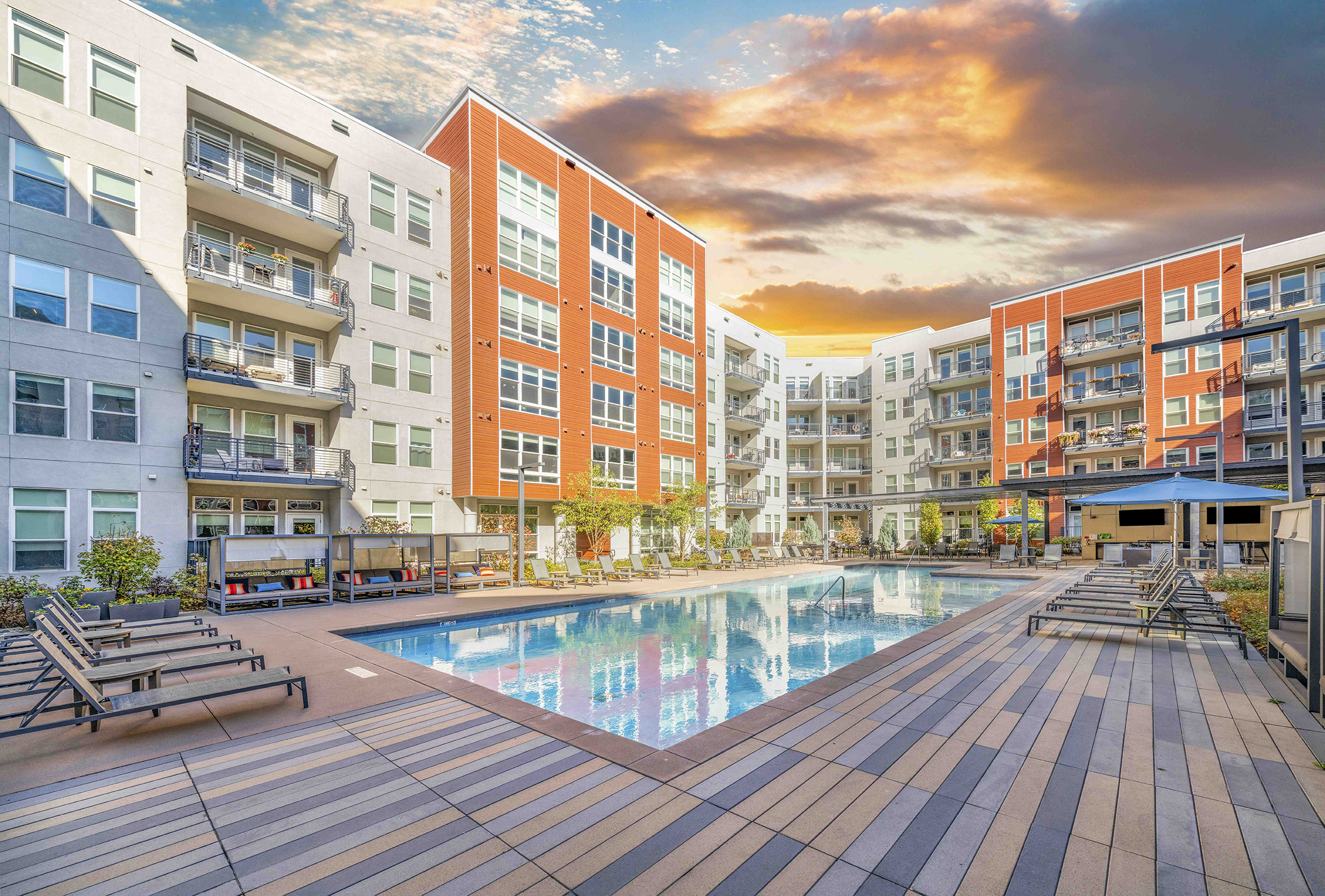 a swimming pool in the middle of an apartment building