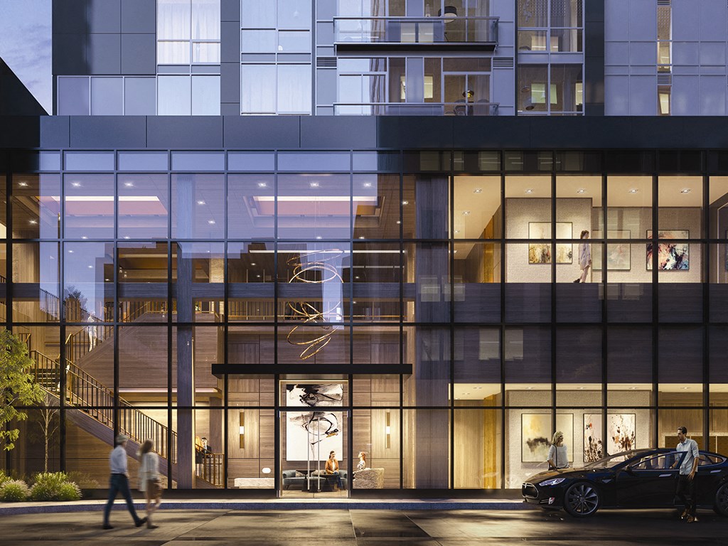 the facade of a building with people walking in front of it