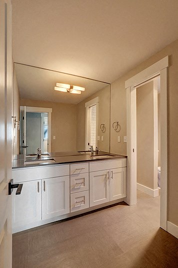 a bathroom with a sink and a large mirror