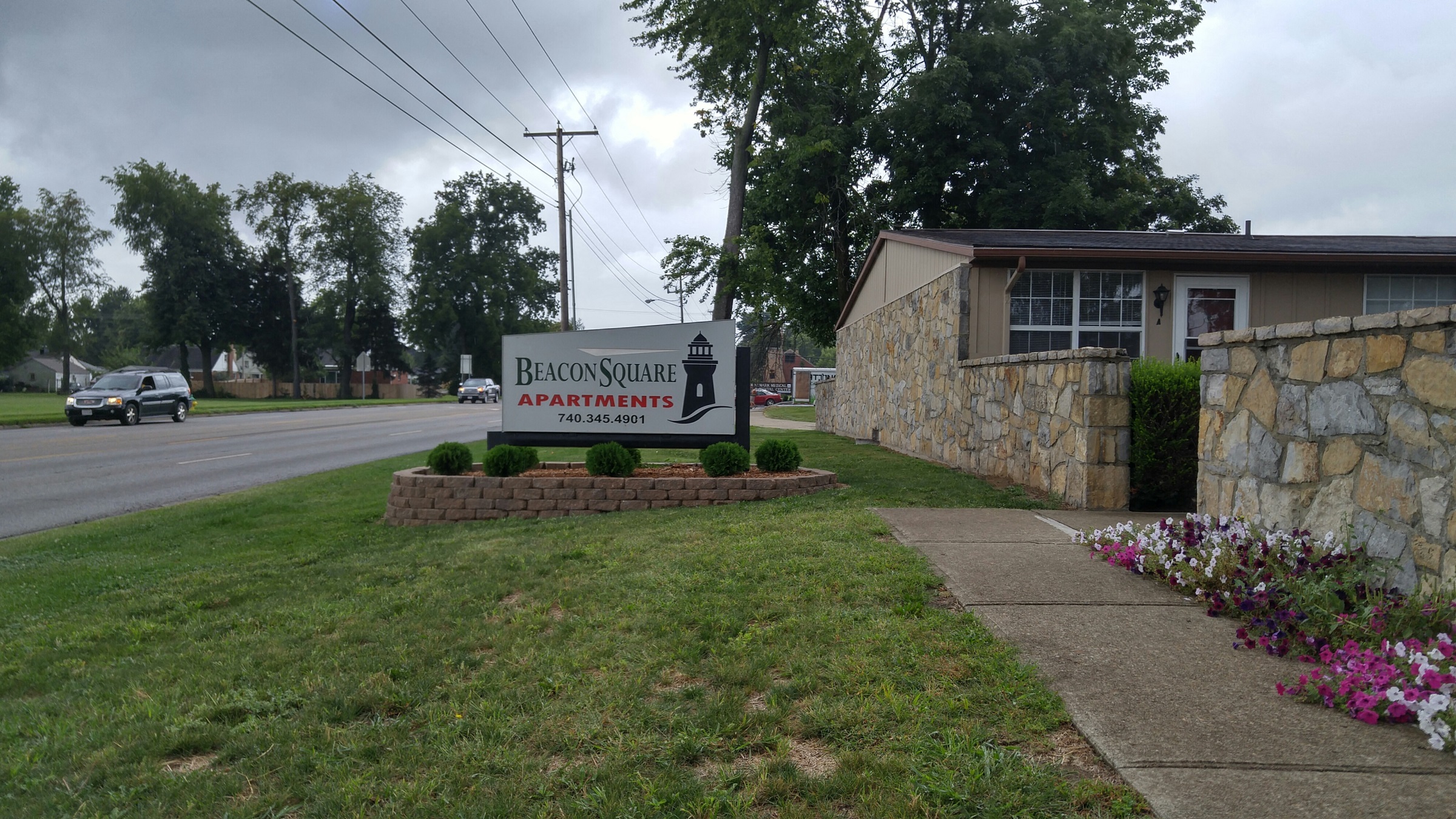 a building with a sign for bloom youth apartments