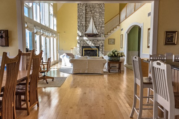 the living room and dining room of a house