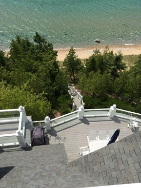 the view from the top of the roof of a building overlooking a beach