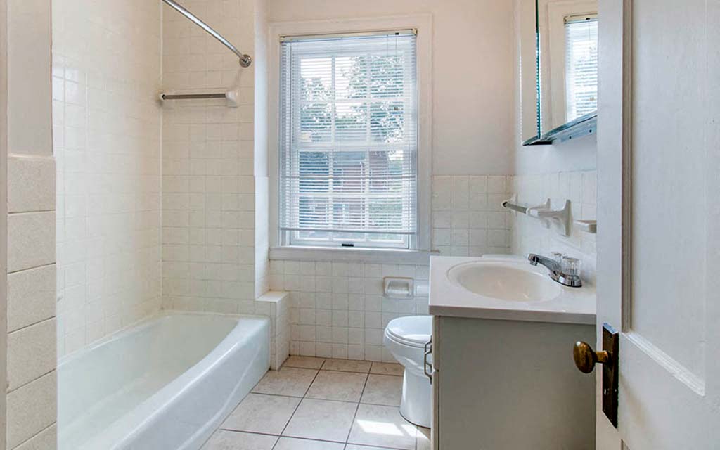 a bathroom with a sink toilet and a bath tub