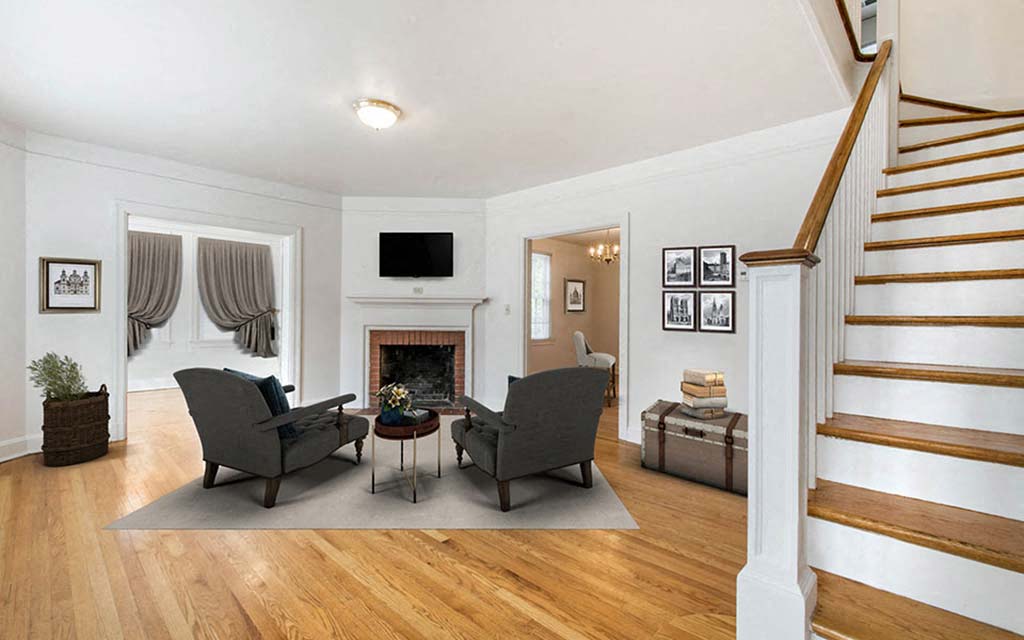 a living room with two chairs and a fireplace