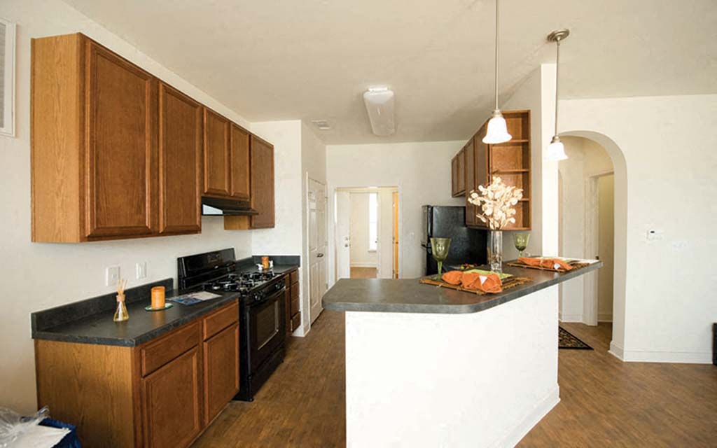 a kitchen with a counter top and a stove