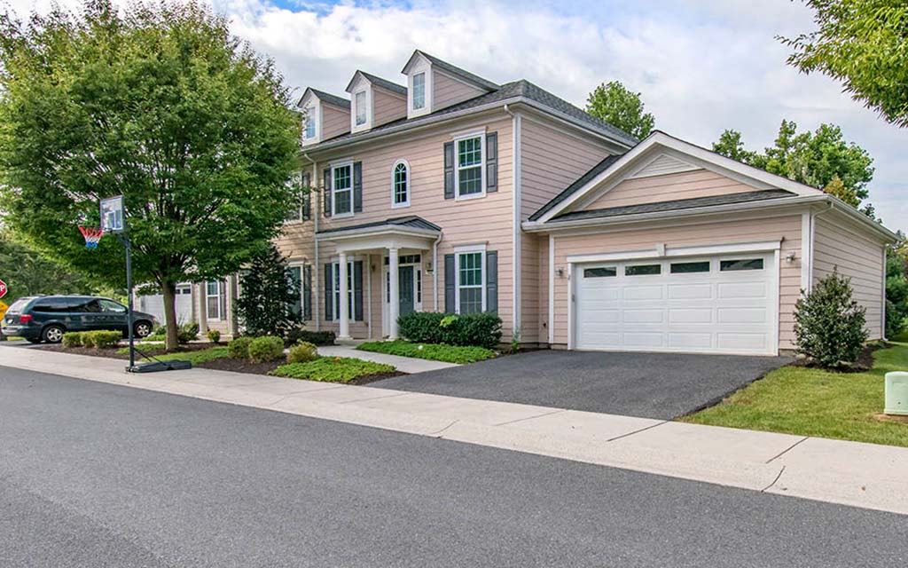 a house with a driveway and a garage door