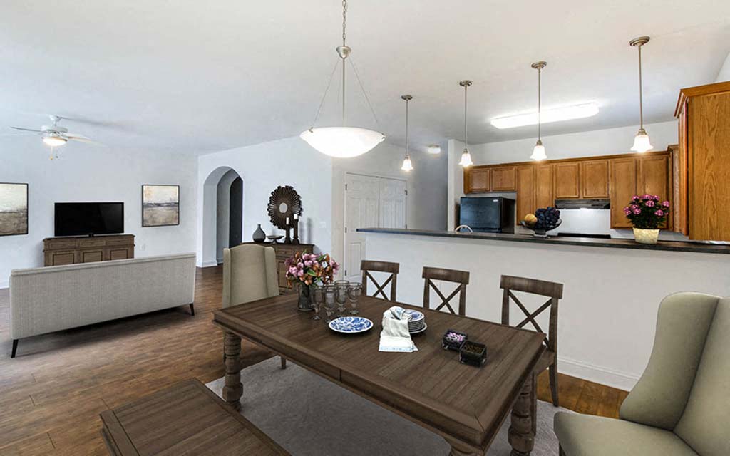 a living room and dining room with a wooden table