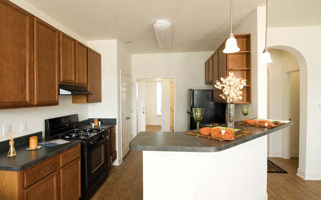 a kitchen with a counter top and a stove