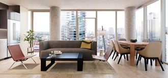 a living room and dining room with a view of the city