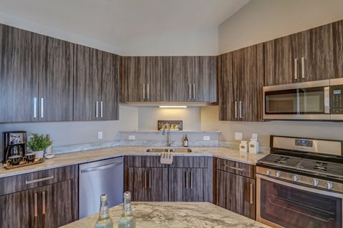 a kitchen with wooden cabinets and a counter top