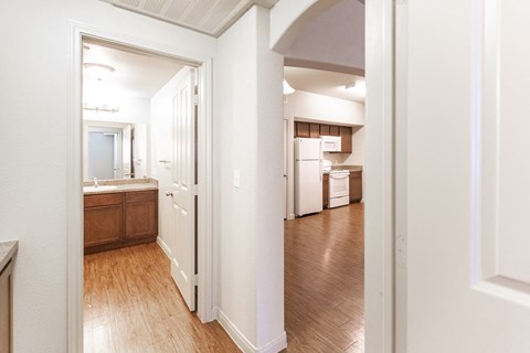 a view of a kitchen and living room from a doorway