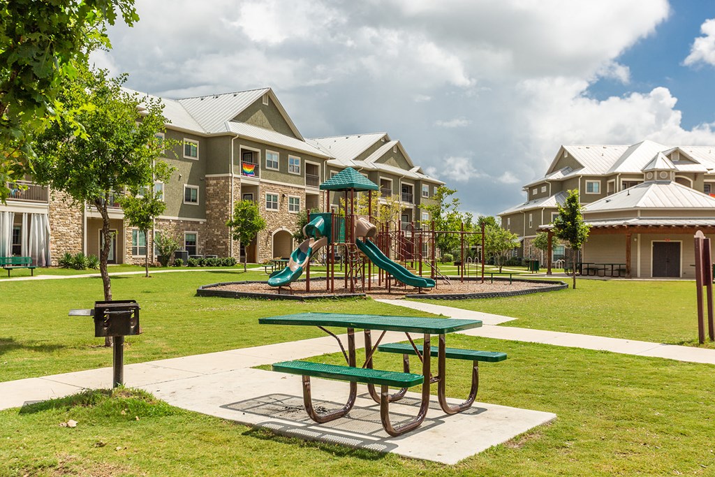 the preserve at ballantyne commons park with playground and picnic table