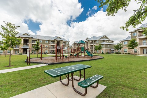 the preserve at ballantyne commons park with playground and picnic table