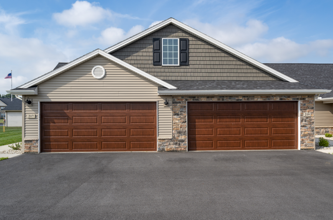 A two-car garage is attached to a house.