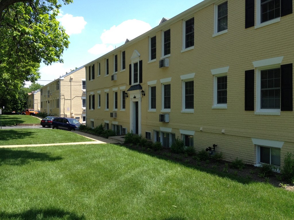 a row of apartment buildings on a city street