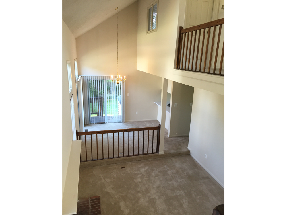a view of the living room from the top of the stairs