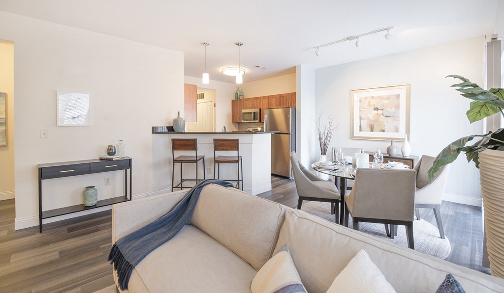 a living room and dining room with a couch and a table