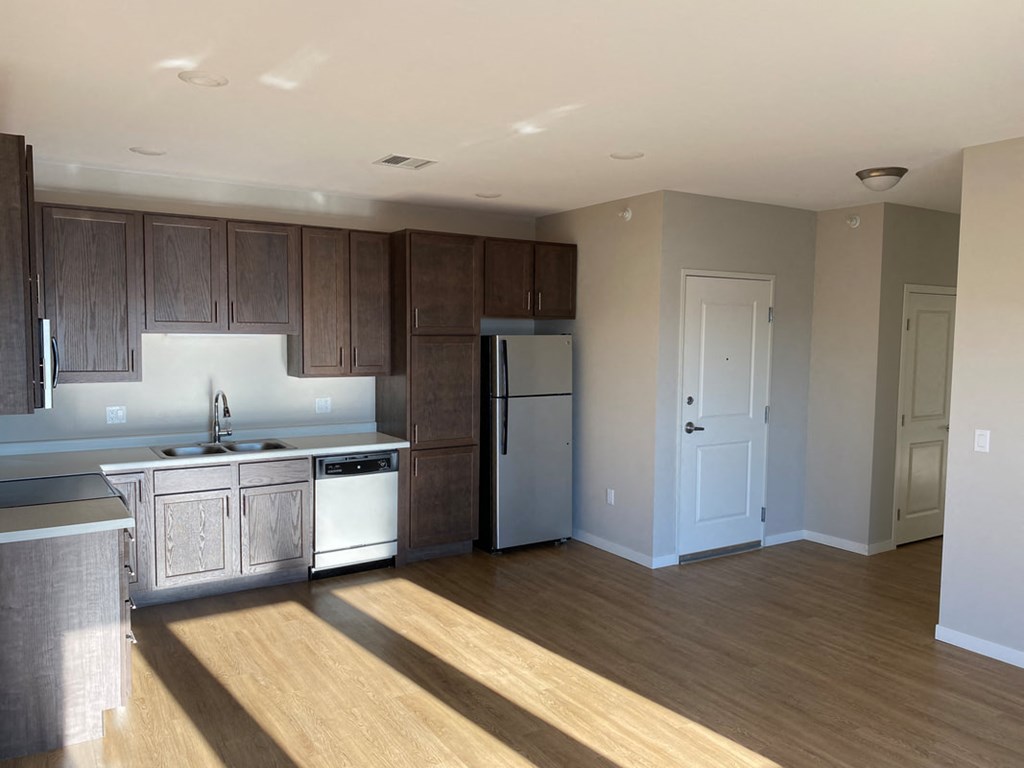 a kitchen with stainless steel appliances and wooden cabinets