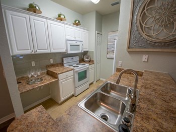 Stainless Steel Sink With Faucet In Kitchen Stainless Steel Sink With Faucet In Kitchen at Century Capital City Apartments , Tallahassee, Florida - Photo Gallery 3