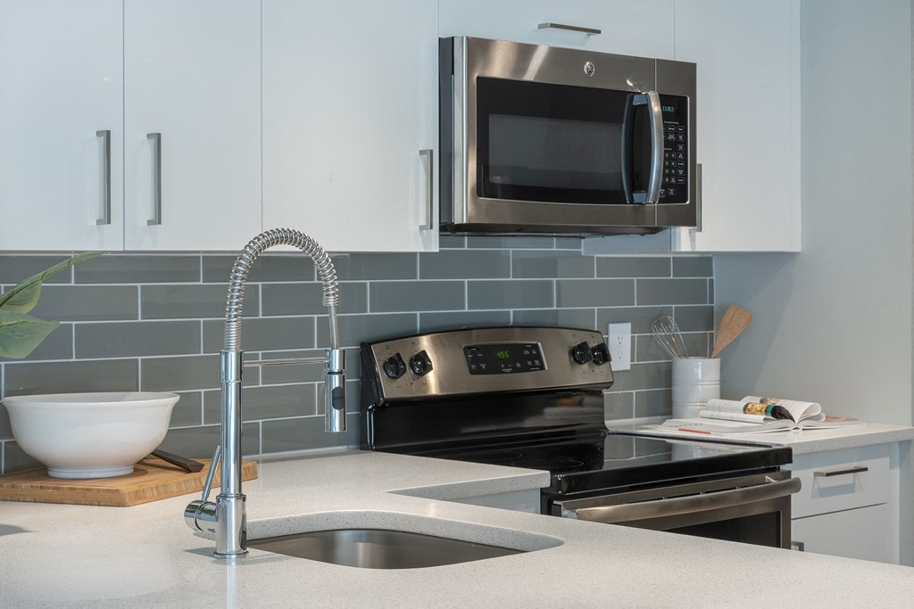 a kitchen with stainless steel appliances and a sink