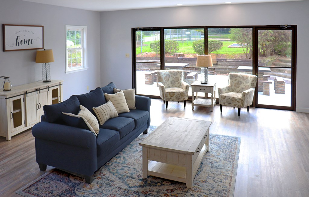 a living room with a blue couch and a coffee table