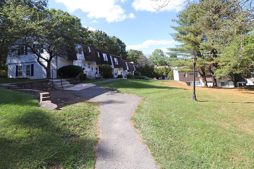 a view of a neighborhood with houses and a sidewalk