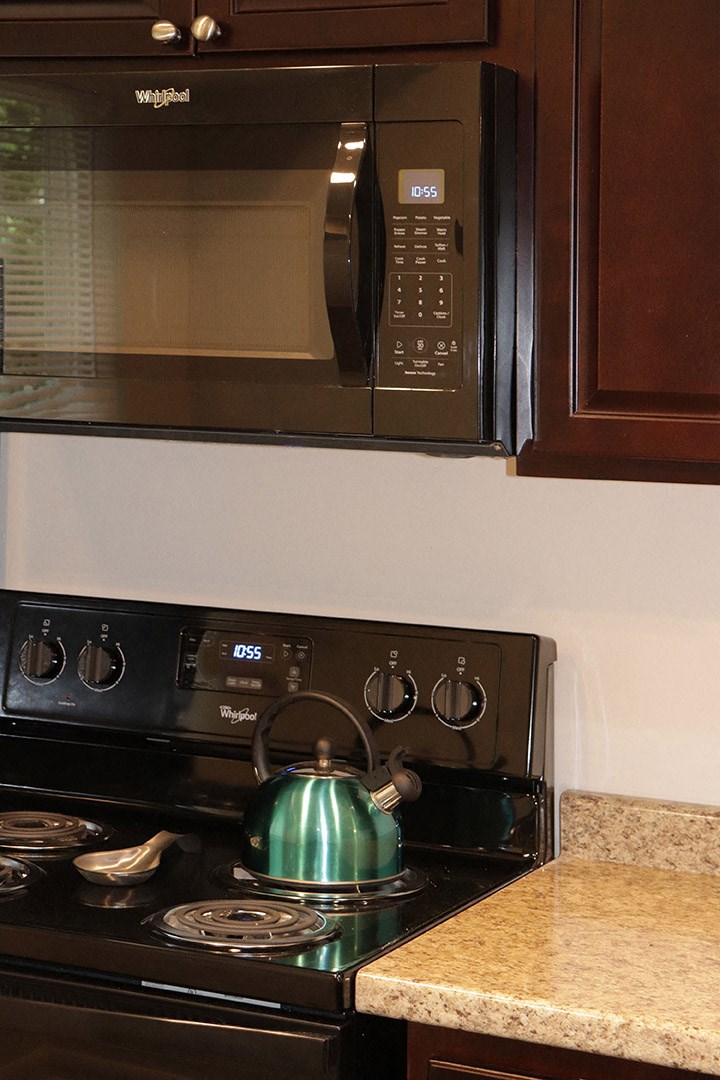 a teapot on the stove in a kitchen