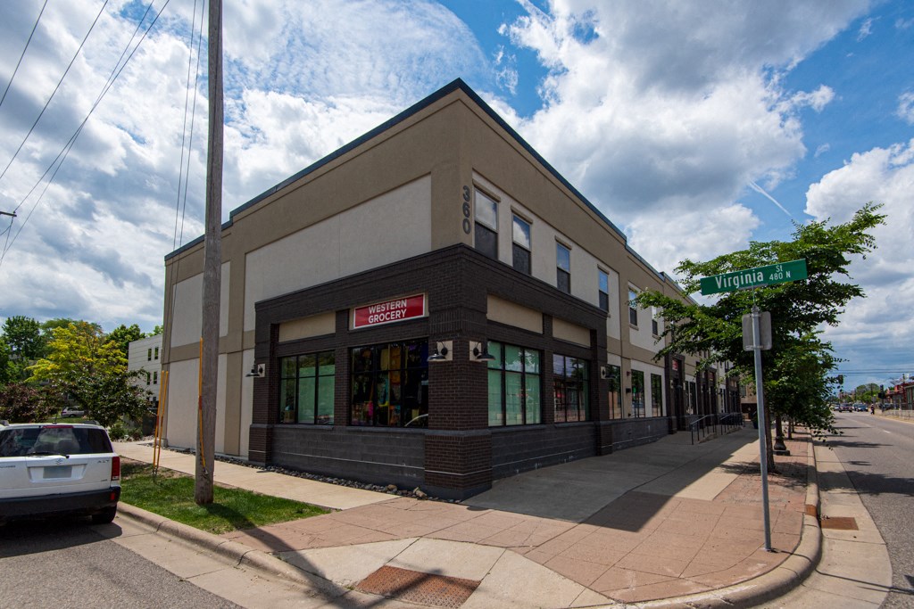 a brick building on the corner of a city street