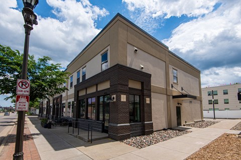 a brick building with a no parking sign in front of it
