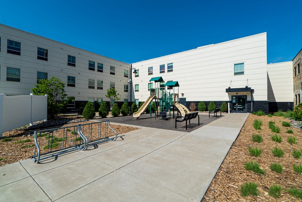 the childrens play area in therium of a building with playground equipment