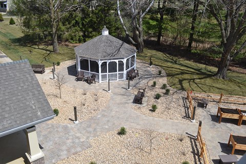 a gazebo in the middle of a yard