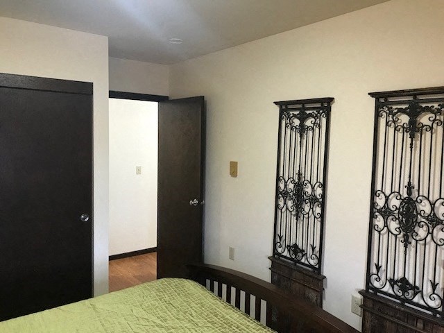 a bedroom with a bed and a door