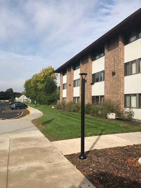 a building with a street light in front of it