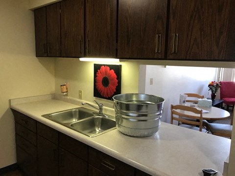 a kitchen with a stainless steel pot on the counter