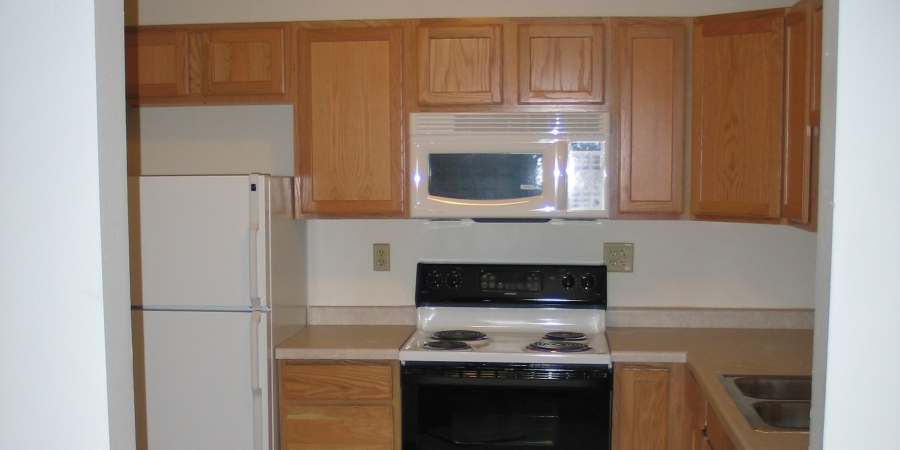 a kitchen with a stove microwave and refrigerator
