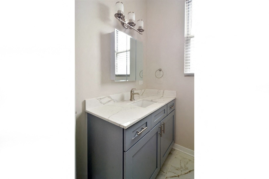 renovated bathroom marble lincoln park apartment chicago 60614