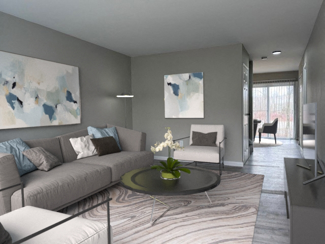 a living room with grey couches and a coffee table