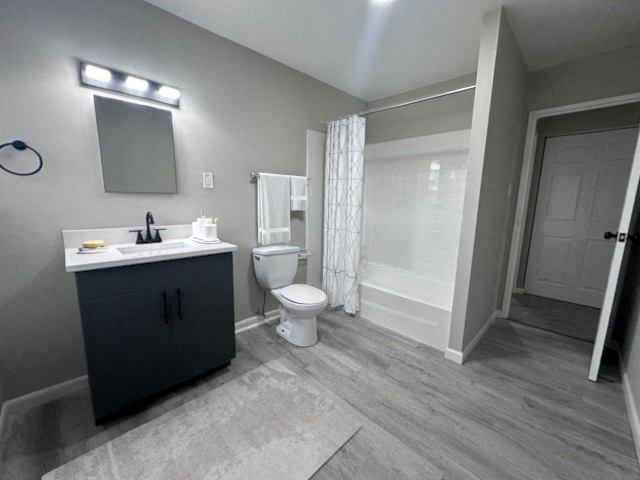 a bathroom with a sink toilet and a shower