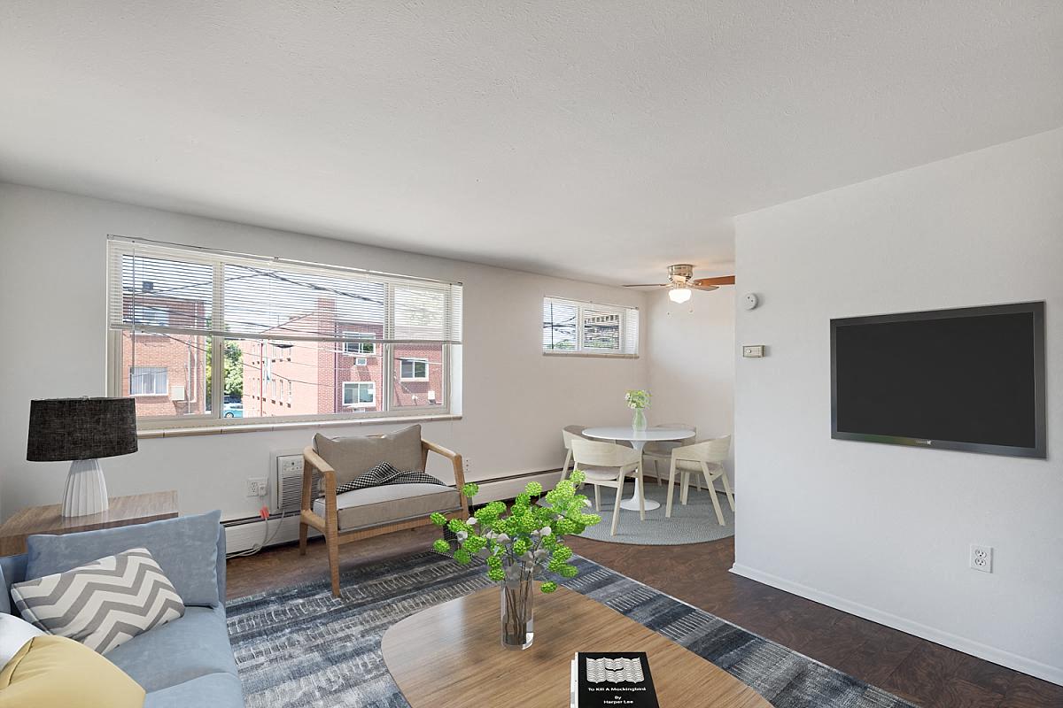 a living room with a couch and a table and a television